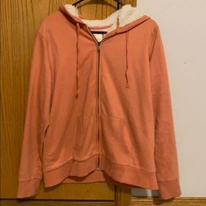 Zip up jacket with fuzzy lining.